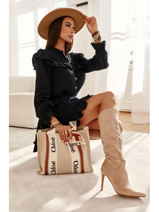 Classic Suede Black Boots On A Beige Ameya