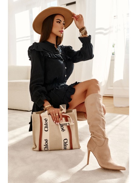 Classic Suede Black Boots On A Beige Ameya