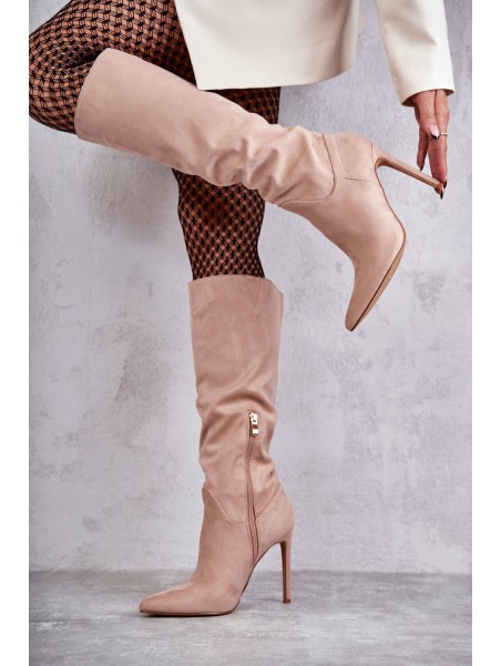 Classic Suede Black Boots On A Beige Ameya