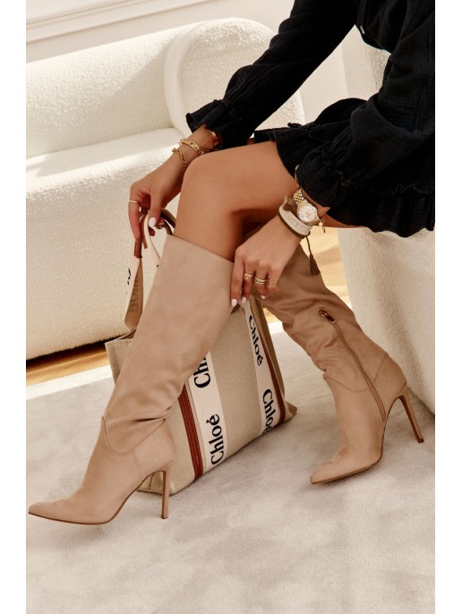 Classic Suede Black Boots On A Beige Ameya